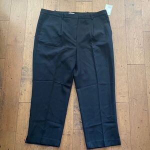 Black dress pants. Button and zip closure.